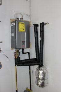 Ultiamte Plumbing intalls a tankless water heater from a tank water heater in mooresville